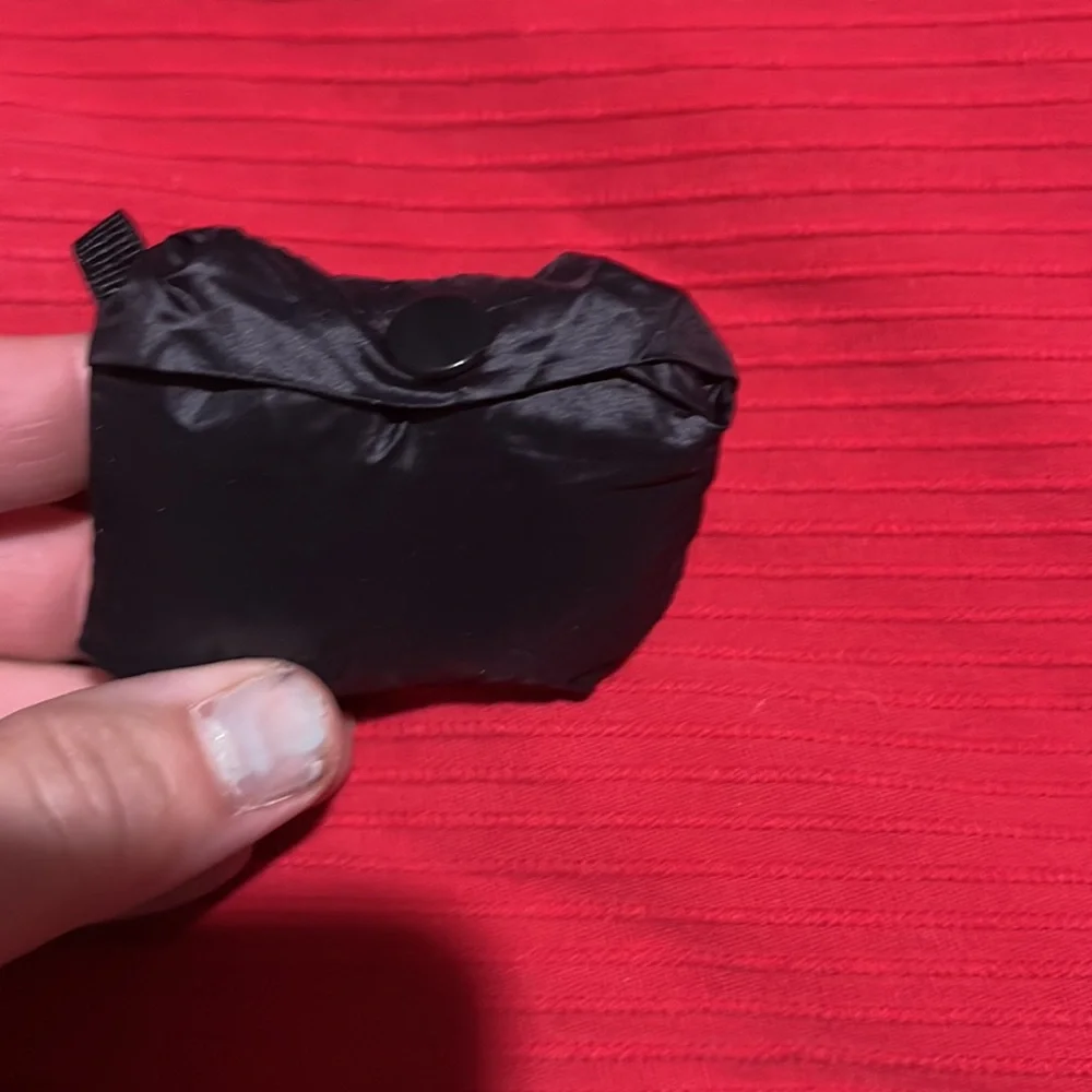 CK black draw string bag, used but great condition. Black and silver 12” x 5”